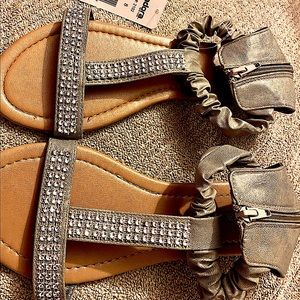 Gray sandals with rhinestones on the front